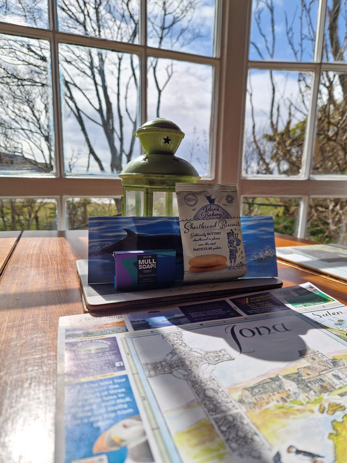Welcome touches on the table — lantern, Island Bakery shortbread, Mull soap, and an Iona map